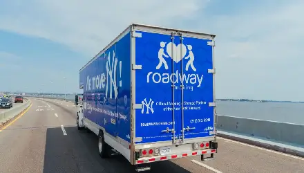 Roadway Moving's truck on a bridge delivering a long-distance move